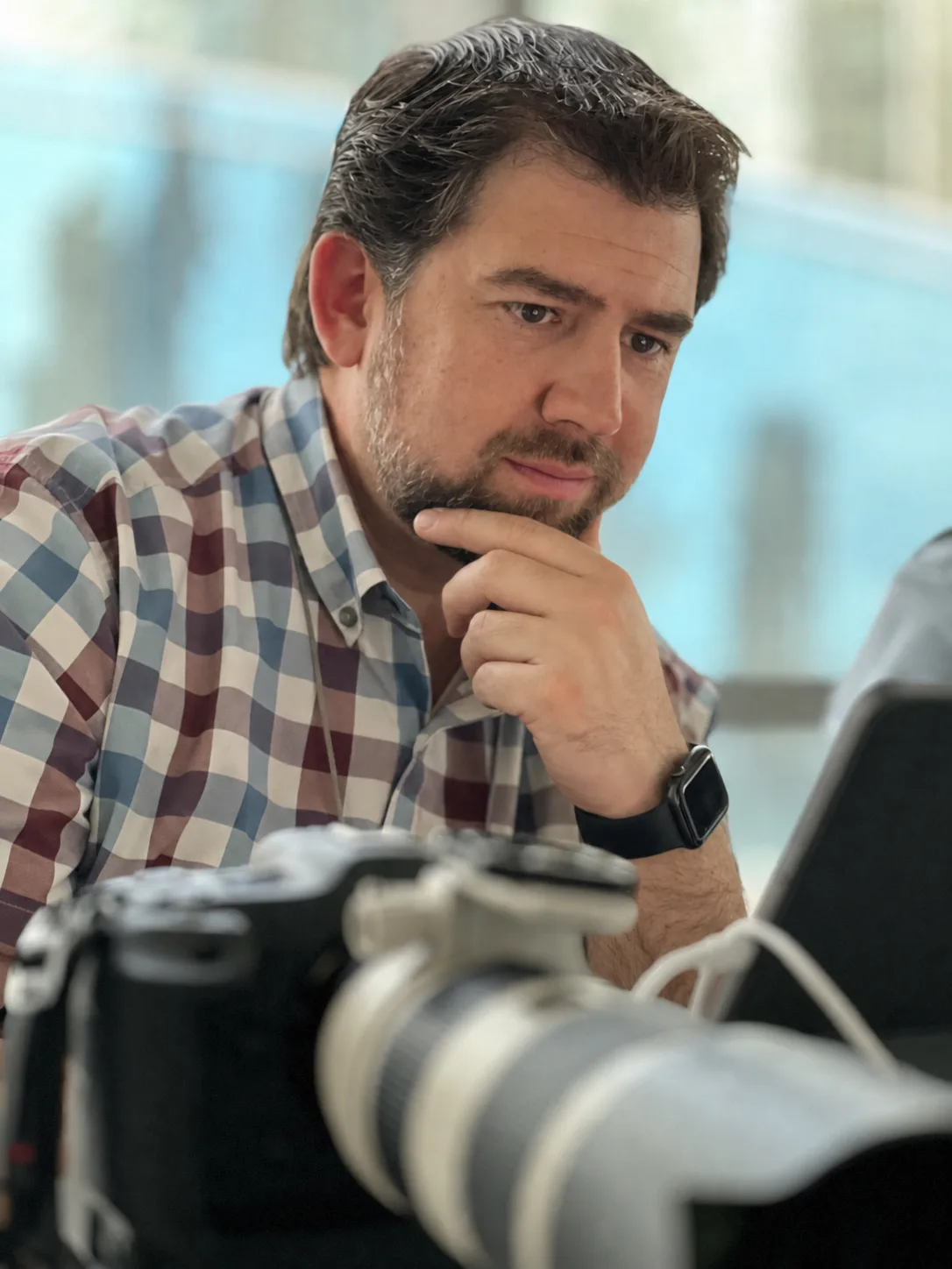 Salvador Garza working beside his camera equipment